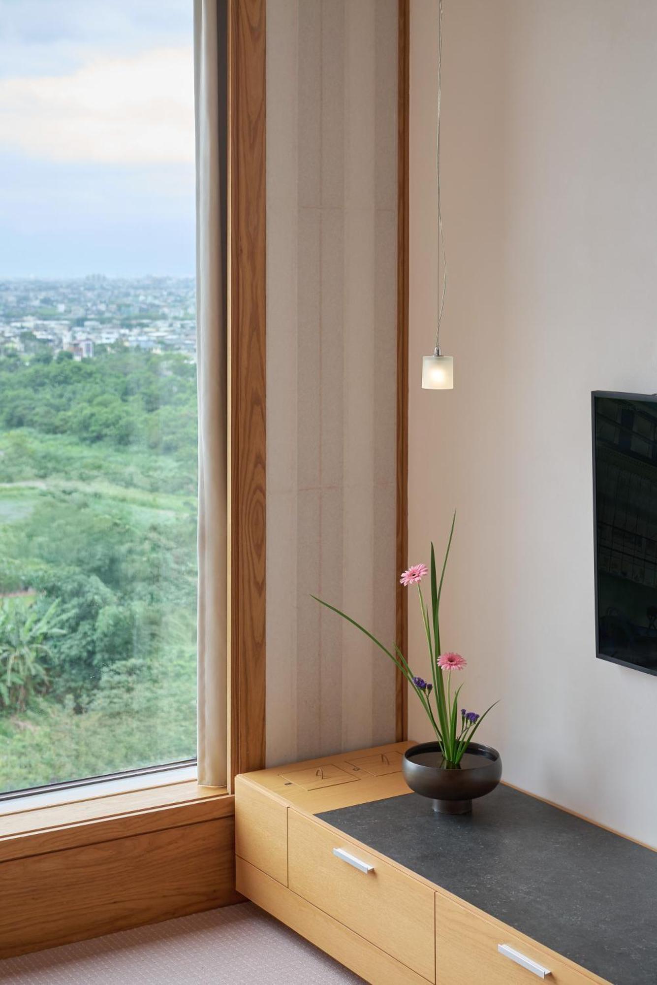 โรงแรมรอยัล เจียว ซี เจียวซี ภายนอก รูปภาพ A pendant light