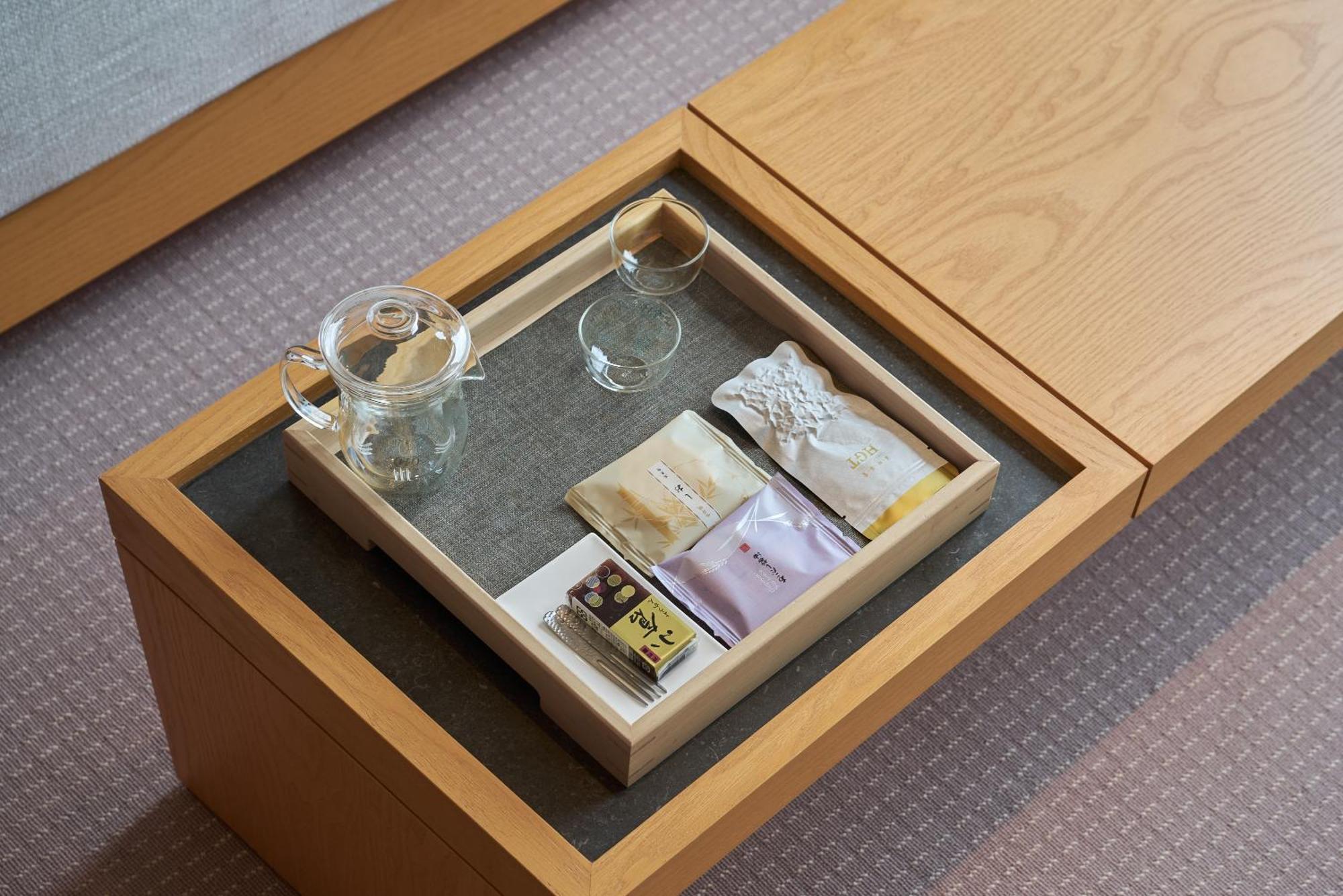 โรงแรมรอยัล เจียว ซี เจียวซี ภายนอก รูปภาพ A tea tray in a hotel room